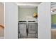 Modern laundry room with side-by-side washer and dryer at 2263 Nottley Dr # 2, Marietta, GA 30066