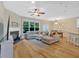 Open concept living room with a fireplace, large windows, and hardwood flooring at 2263 Nottley Dr # 2, Marietta, GA 30066