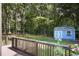 Scenic view of a well-maintained backyard with lush greenery and a shed at 476 Concord Se Ln, Smyrna, GA 30082
