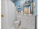 Cozy bathroom featuring white tiles, vanity, and decor for a clean aesthetic at 476 Concord Se Ln, Smyrna, GA 30082