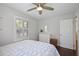 Bedroom with light blue patterned bedding, shuttered windows and wood floors at 476 Concord Se Ln, Smyrna, GA 30082