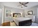 Comfortable bedroom with large windows, ceiling fan, and neutral-toned bedding at 476 Concord Se Ln, Smyrna, GA 30082