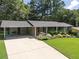 Spacious ranch home with a covered carport and well-maintained lawn, ideal for easy living at 476 Concord Se Ln, Smyrna, GA 30082