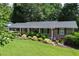 Charming brick ranch home featuring a beautifully landscaped front yard and inviting entrance at 476 Concord Se Ln, Smyrna, GA 30082