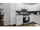 Well-lit kitchen with stainless steel oven and range, offering an efficient cooking space at 476 Concord Se Ln, Smyrna, GA 30082