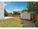 Spacious backyard with a shed, lush lawn, and a concrete patio area for outdoor enjoyment at 6298 Gothards Ln, Douglasville, GA 30134