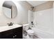 Bathroom offers a single sink, toilet and shower combination with white tile at 6298 Gothards Ln, Douglasville, GA 30134