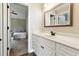 Bathroom with a large vanity sink and a glimpse into another bedroom area at 6298 Gothards Ln, Douglasville, GA 30134