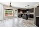Open-concept kitchen with dark cabinets, stainless steel appliances, and plenty of counter space at 6298 Gothards Ln, Douglasville, GA 30134