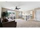 Comfortable loft area featuring a ceiling fan, carpet flooring, and natural light at 6298 Gothards Ln, Douglasville, GA 30134
