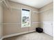 Walk-in closet featuring wire shelving and a large window for ample natural light at 6298 Gothards Ln, Douglasville, GA 30134