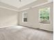 Generous bedroom with a tray ceiling and two windows that let in plenty of natural light at 88 Timber Ridge Dr, Cartersville, GA 30121