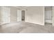 Large bedroom with carpeting, two doors and an attached bathroom with tub at 88 Timber Ridge Dr, Cartersville, GA 30121