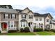 Charming townhome with manicured lawn, bay window, black shutters, and welcoming entrance at 88 Timber Ridge Dr, Cartersville, GA 30121