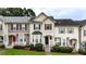Charming townhome featuring manicured lawn, black shutters, bay window and inviting front porch at 88 Timber Ridge Dr, Cartersville, GA 30121