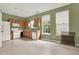 Bright kitchen featuring oak cabinets, white appliances, and a window with green view at 88 Timber Ridge Dr, Cartersville, GA 30121