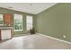 Spacious kitchen area with oak cabinets and natural light from two large windows at 88 Timber Ridge Dr, Cartersville, GA 30121
