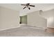 Spacious living room featuring neutral walls, a ceiling fan, and stairs to the second floor at 88 Timber Ridge Dr, Cartersville, GA 30121