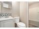 Bathroom featuring a vanity with eye-catching backsplash and a shower/tub combo at 114 Howell Sw Dr, Atlanta, GA 30331