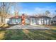 Spacious backyard features a large brick patio and view of the rear of the house at 1403 W Prospect Dr, Lawrenceville, GA 30043