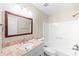 Updated bathroom featuring granite countertops, a large vanity, and a shower at 1403 W Prospect Dr, Lawrenceville, GA 30043