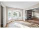 Dining area with a bay window view and an open layout to the living room at 1403 W Prospect Dr, Lawrenceville, GA 30043