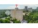 Aerial view of a high-rise apartment building surrounded by trees, showcasing the urban and natural environment at 2479 Peachtree Ne Rd # 201, Atlanta, GA 30305