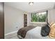 Cozy bedroom with a large window offering great lighting and neutral wall color at 2479 Peachtree Ne Rd # 201, Atlanta, GA 30305