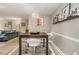 Dining area adjacent to living room features a black table and a stylish decor shelf at 2479 Peachtree Ne Rd # 201, Atlanta, GA 30305
