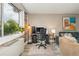 Bright workspace featuring a modern desk setup, large window with natural light, and comfortable seating at 2479 Peachtree Ne Rd # 201, Atlanta, GA 30305