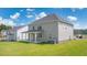 Well-maintained backyard showcasing the home's exterior and spacious green area at 2929 Champions Way, Loganville, GA 30052