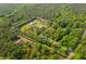 Aerial view of a 5-acre property surrounded by lush greenery, showcasing property lines at 639 Hall Station Rd, Kingston, GA 30145