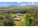 Aerial view of a home nestled in a forest landscape, highlighting its serene setting at 639 Hall Station Rd, Kingston, GA 30145