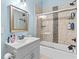 Light-filled bathroom with tiled shower, vanity, and neutral fixtures at 639 Hall Station Rd, Kingston, GA 30145