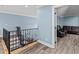 Cozy upper landing features a railing and leads to a comfortable bonus room at 639 Hall Station Rd, Kingston, GA 30145