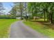 View of the properties driveway, lawn, and various outbuildings at 639 Hall Station Rd, Kingston, GA 30145