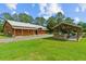 Expansive house with an outdoor gazebo and a large grassy yard, ideal for outdoor activities at 639 Hall Station Rd, Kingston, GA 30145