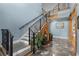 Grand foyer with an ornate staircase, marble flooring, and natural light at 639 Hall Station Rd, Kingston, GA 30145