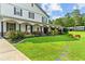 Spacious front lawn with mature trees and a charming, covered porch at 639 Hall Station Rd, Kingston, GA 30145