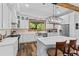 Modern kitchen with white cabinets, stainless appliances, and center island at 639 Hall Station Rd, Kingston, GA 30145