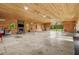 Vast living area with wood paneling, fireplace, and basketball hoop provides endless possibilities at 639 Hall Station Rd, Kingston, GA 30145