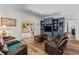 Comfortable living room with hardwood floors, custom built-ins, and a cozy seating area at 639 Hall Station Rd, Kingston, GA 30145