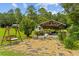 Charming outdoor lounge area with a swing and seating, perfect for relaxation amidst nature at 639 Hall Station Rd, Kingston, GA 30145