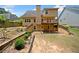 View of the home's backyard featuring a multilevel deck, patio and landscaped features at 9996 Village South Dr, Douglasville, GA 30135