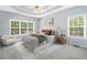 Beautiful bedroom features neutral paint, trey ceiling, soft carpet, and lots of natural light at 9996 Village South Dr, Douglasville, GA 30135