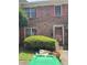 Two-story brick home with charming pink shutters and a well-maintained lawn and garden at 105 Glen Acres Ct, Decatur, GA 30035