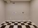 Basement featuring checkerboard floors and neutral paint at 216 Hickory Way, Canton, GA 30115