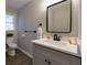 Modern bathroom with a sleek vanity, contemporary mirror, and neutral color palette at 216 Hickory Way, Canton, GA 30115
