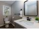 Updated bathroom features a modern vanity and fixtures at 216 Hickory Way, Canton, GA 30115