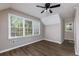 Bright bedroom with hardwood floors and large windows allowing natural light at 216 Hickory Way, Canton, GA 30115